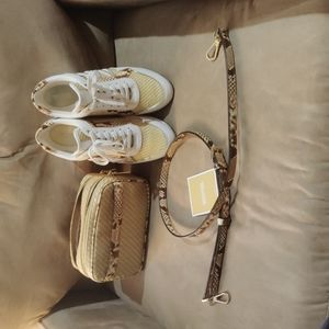 Authentic Michael kors crossbody/clutch/handbag with tennis shoes.